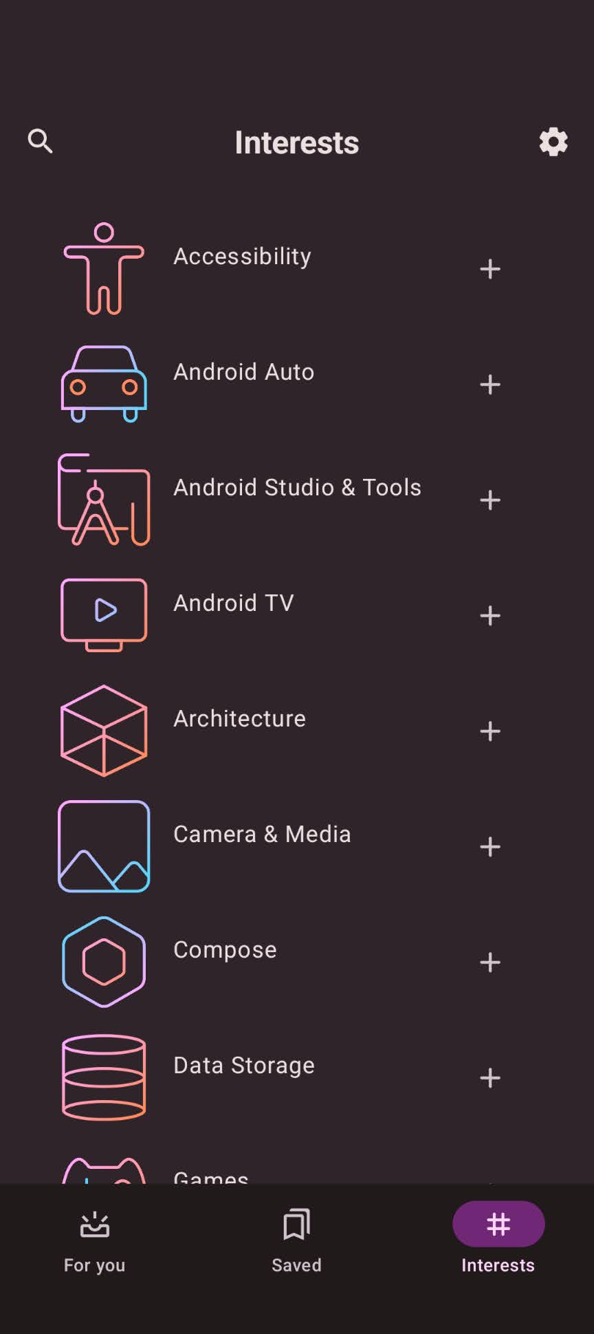 The 'Now in Android' app, showing a feed of articles with titles, topics, and bookmark icons.